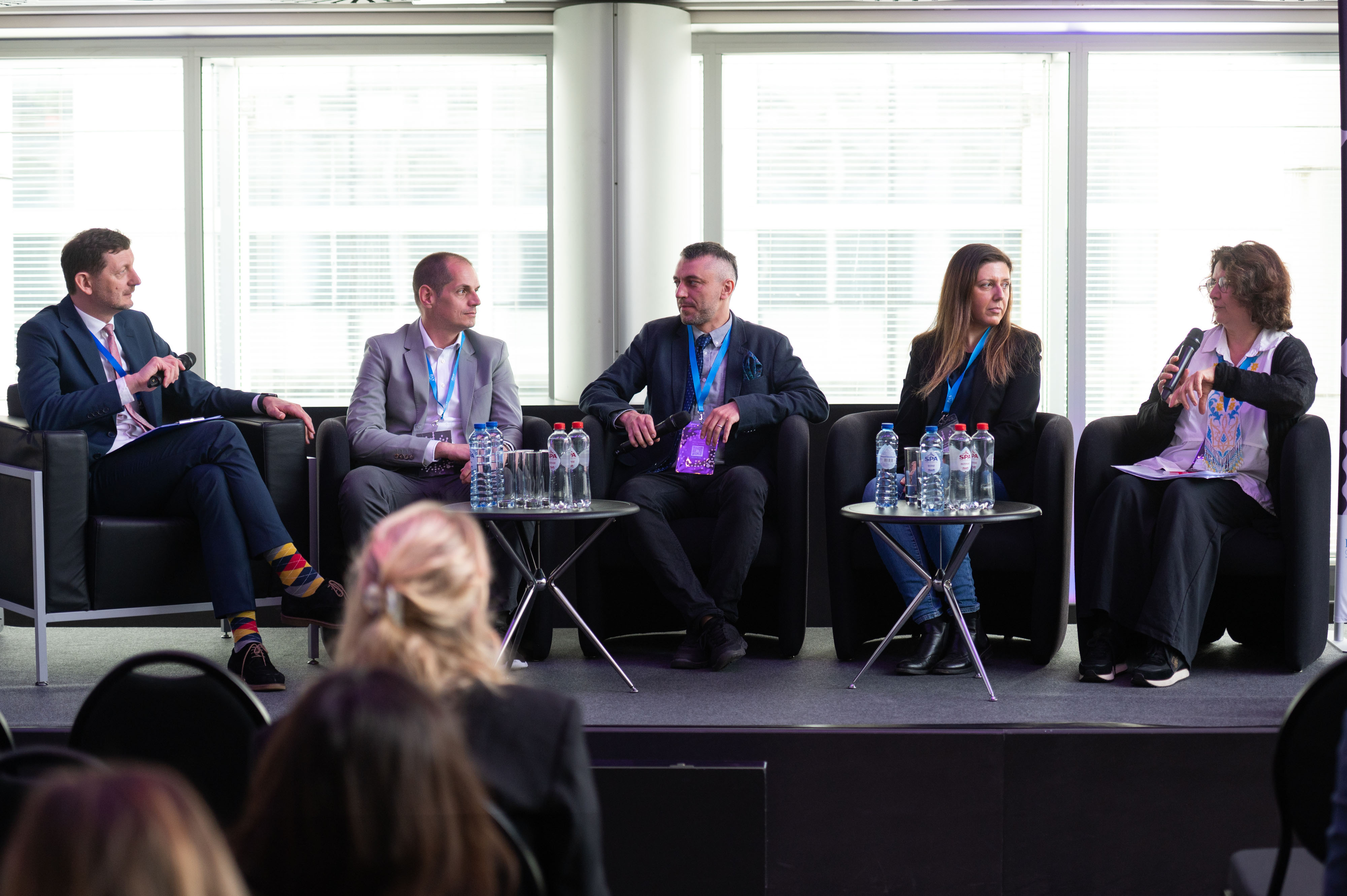 Panel discussion “Making MSCA Work: Career Paths, Institutions and Cross-Border Reality,” featuring (from left to right) Tomasz Poprawka (Polish Academy of Sciences), Michael Nones (MCAA Poland Chapter), Béla Fiser (MCAA Hungary Chapter), Serena Gargiulo (MCAA Benelux Chapter), and Claire Morel (Directorate-General for Education, Youth, Sport and Culture, European Commission). Photo: Kinga Majewska/BXL Frame
