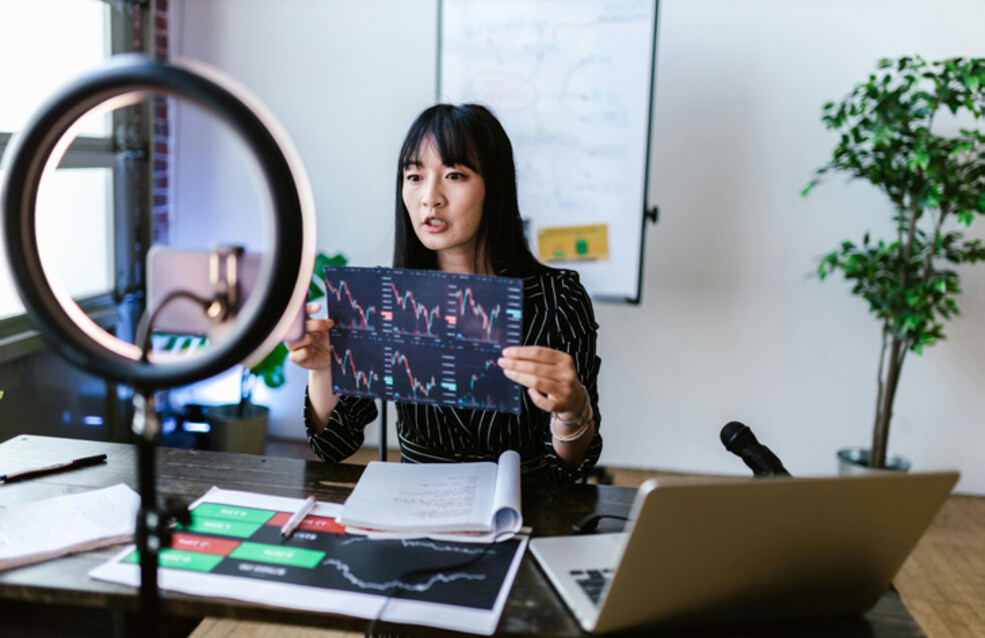 A researcher records a short science communication video using a smartphone