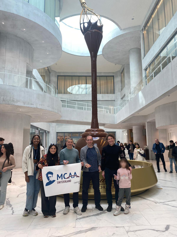 Participating MCAA Switzerland Chapter members and family at the 9.3-meter-tall Lindt chocolate fountain.