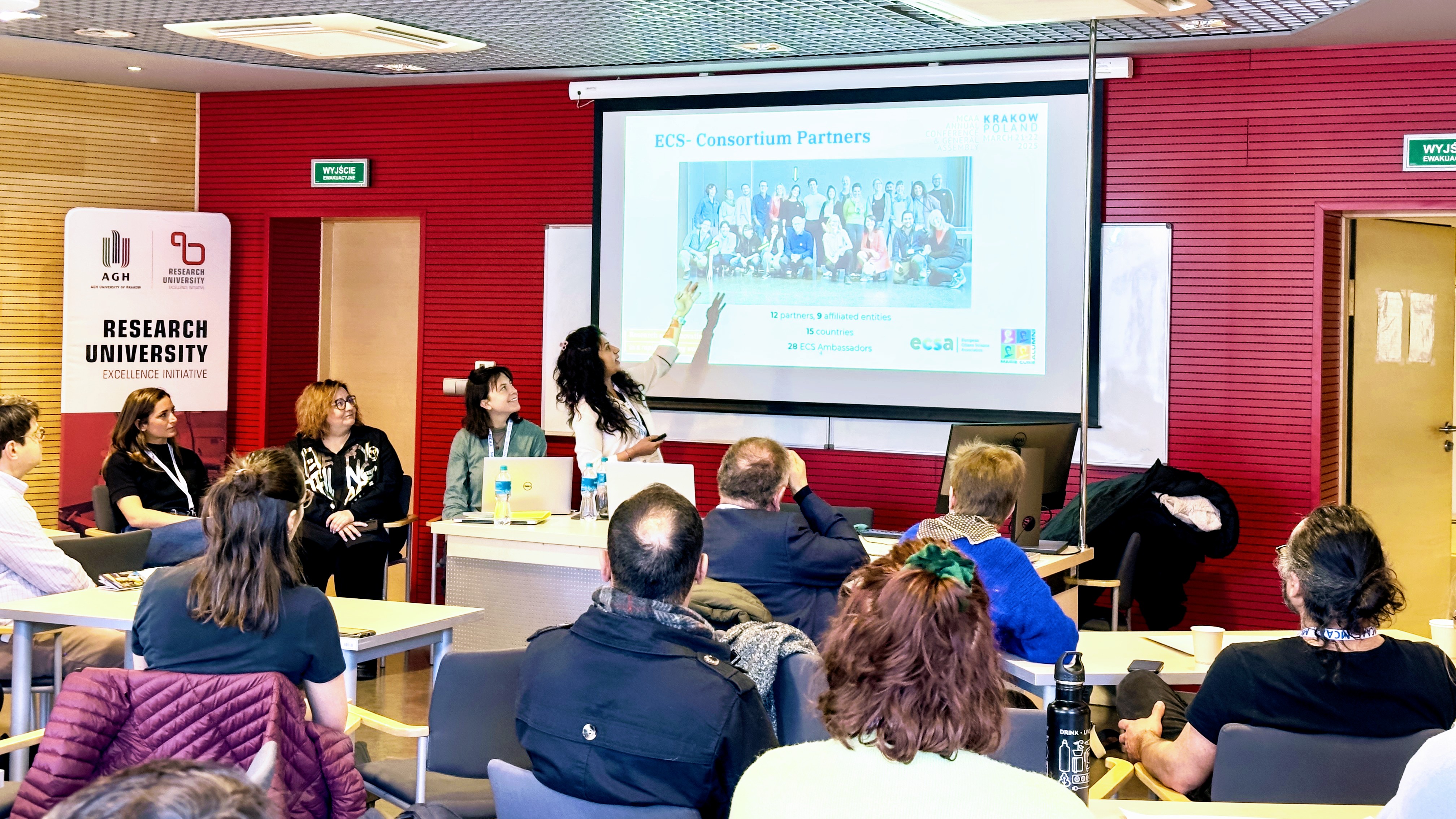 Pooja Khurana introducing the ECS Consortium to the audience.